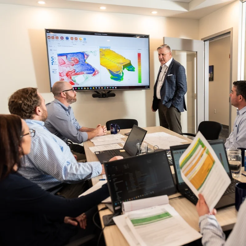 Jay Darcey presenting in a conference room