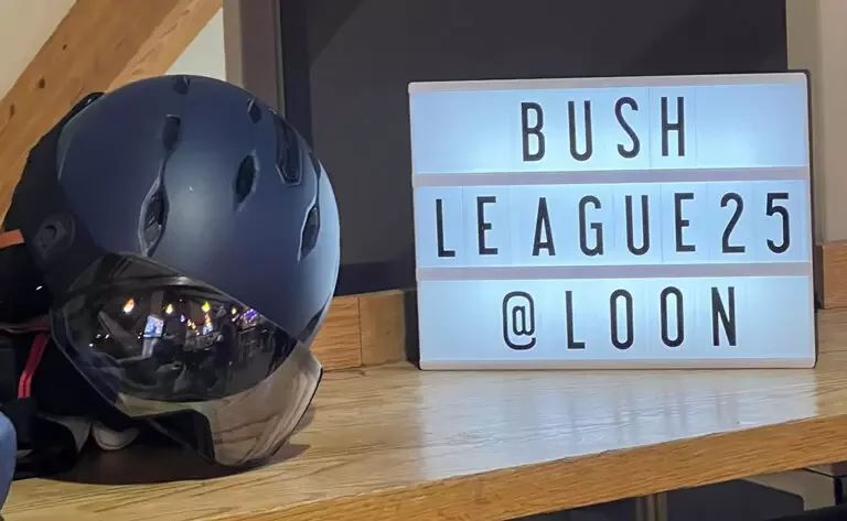 Bush League sign and ski helmet